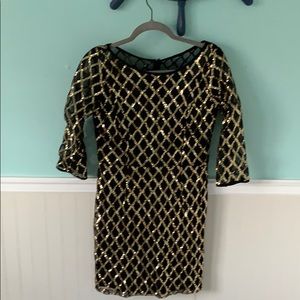 Black and gold sequin dress